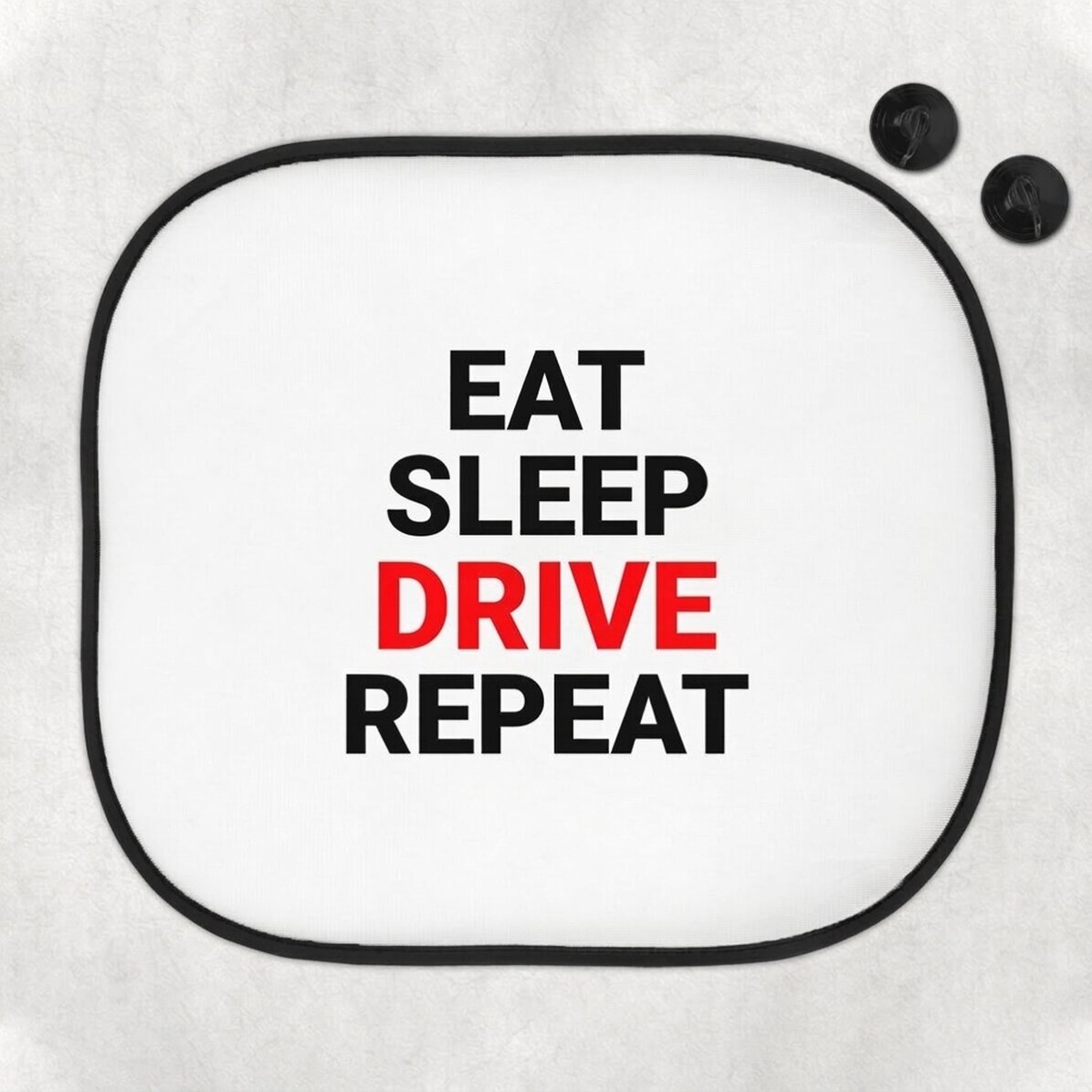 Individuell gestaltete Sonnenblende für das Auto mit dem Schriftzug „Eat, sleep, drive and repeat“