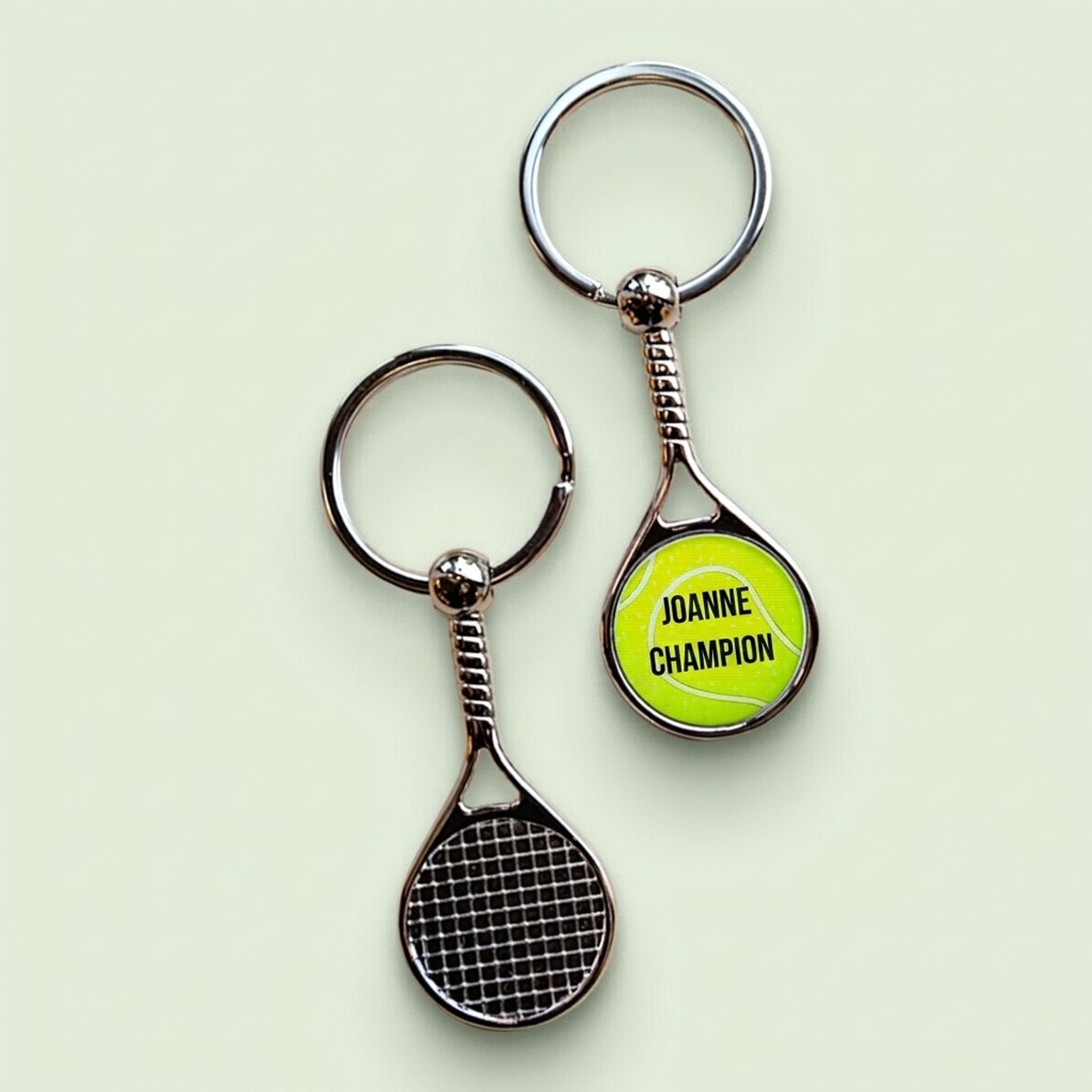 Schlüsselanhänger in Form eines Tennisballs, individuell mit Text bedruckt – Champion